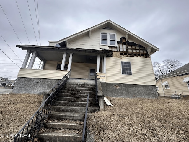 bungalow with stairway and a porch