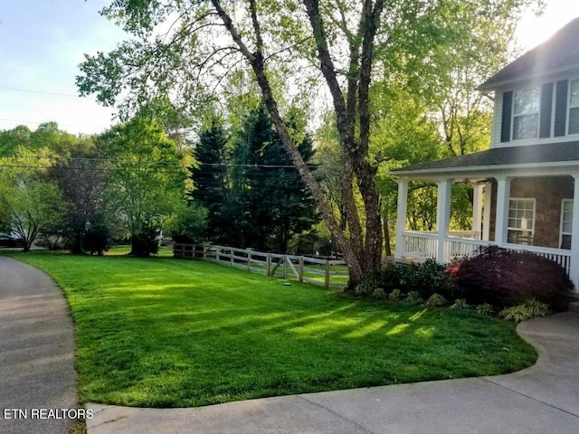 view of yard with covered porch