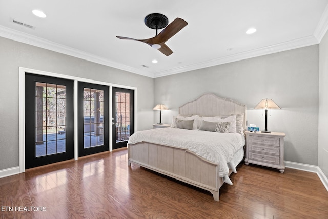 bedroom featuring crown molding, dark hardwood / wood-style floors, and access to exterior