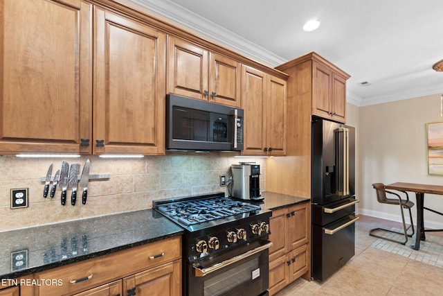 kitchen featuring brown cabinetry, baseboards, ornamental molding, black appliances, and backsplash