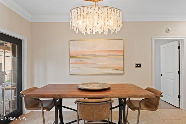 dining space featuring a chandelier and crown molding