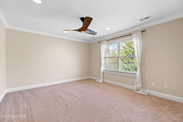 carpeted empty room with visible vents, a ceiling fan, recessed lighting, crown molding, and baseboards