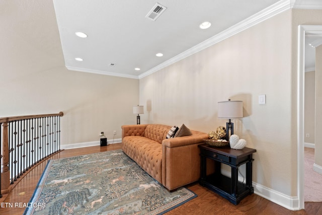 living room featuring ornamental molding and wood-type flooring