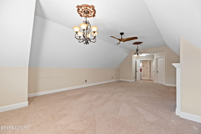 bonus room with lofted ceiling, light colored carpet, and baseboards