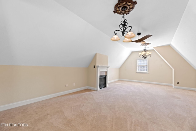 additional living space with lofted ceiling, light colored carpet, and a chandelier