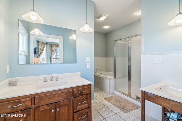 bathroom featuring vanity, tile patterned floors, and shower with separate bathtub