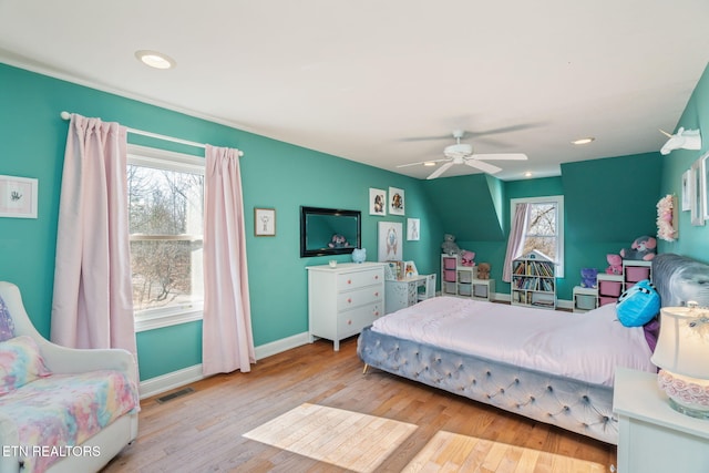 bedroom with ceiling fan and light wood-type flooring