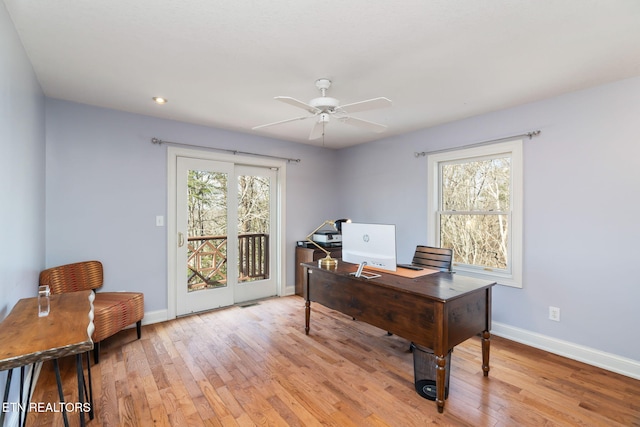 office area featuring ceiling fan, a healthy amount of sunlight, and light wood-type flooring