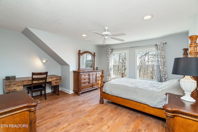 bedroom featuring light hardwood / wood-style floors and ceiling fan