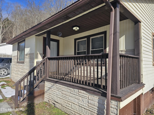 doorway to property with covered porch