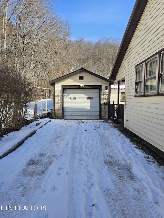 view of snow covered garage