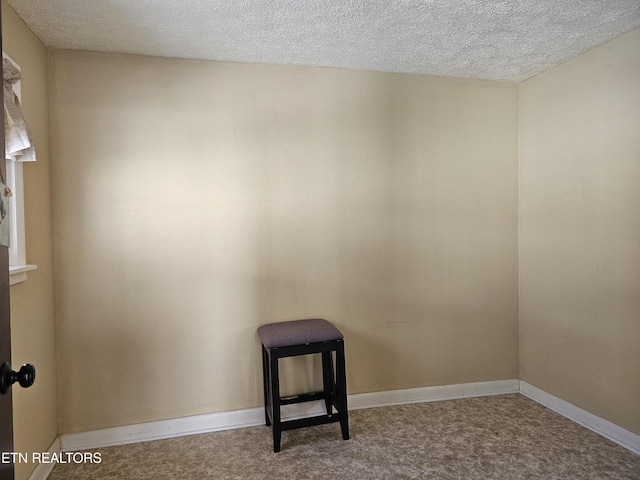 empty room featuring a textured ceiling