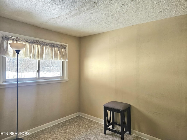 unfurnished room with a textured ceiling