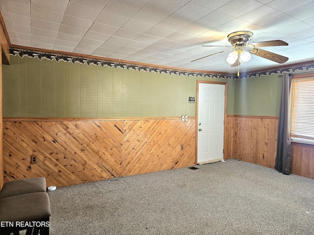 unfurnished room featuring carpet floors and ceiling fan