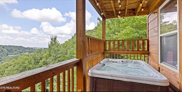 deck with a hot tub