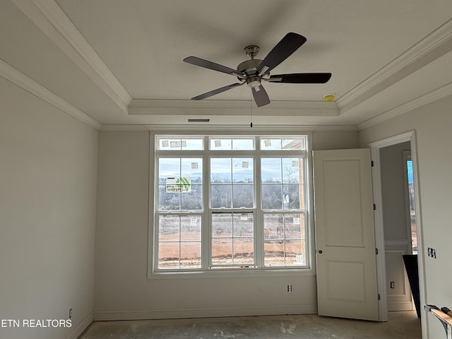 unfurnished room featuring ornamental molding, a raised ceiling, and ceiling fan