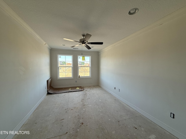 unfurnished room with baseboards, ornamental molding, and a textured ceiling