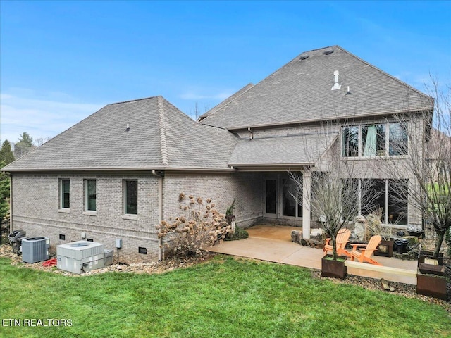 back of property featuring central AC, a patio area, and a lawn