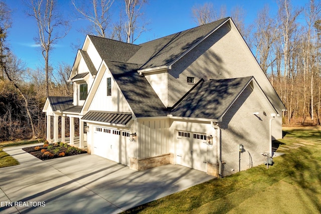 view of home's exterior with a garage and a lawn