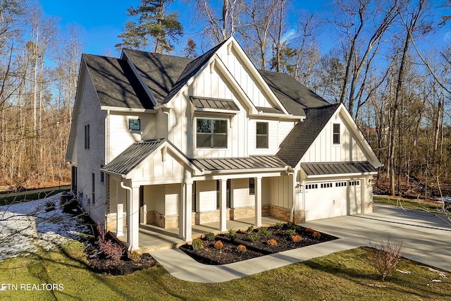 modern farmhouse style home with a garage and a porch