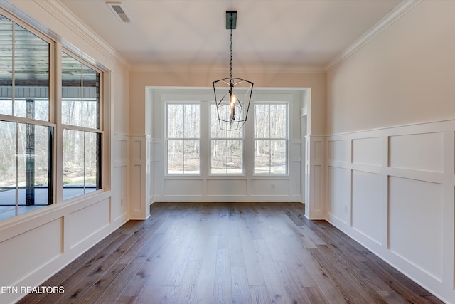 interior space featuring crown molding, a chandelier, and dark hardwood / wood-style flooring