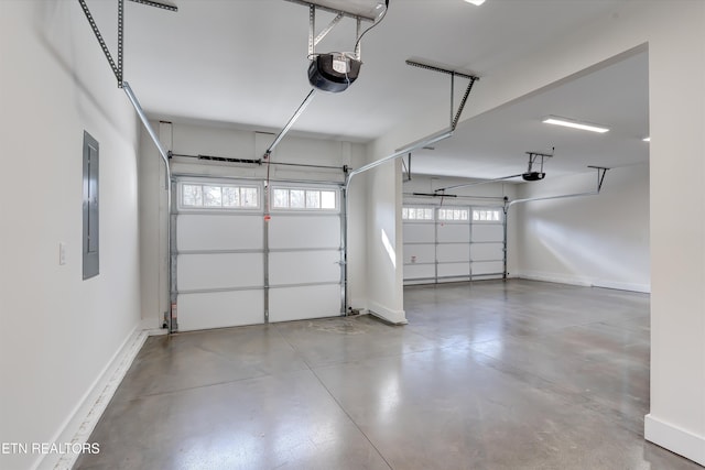 garage featuring a garage door opener and electric panel