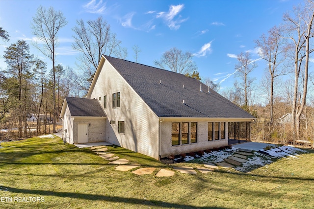 back of house with a yard