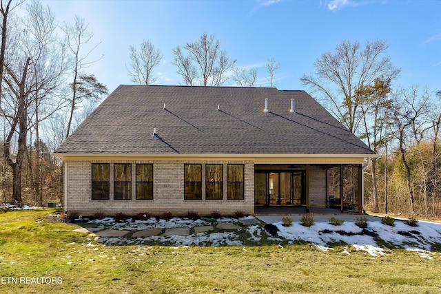 back of house with a yard