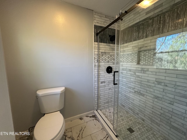 bathroom featuring an enclosed shower and toilet