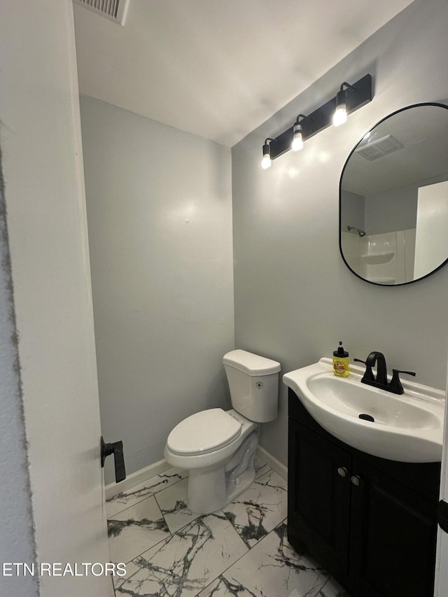 bathroom with vanity and toilet