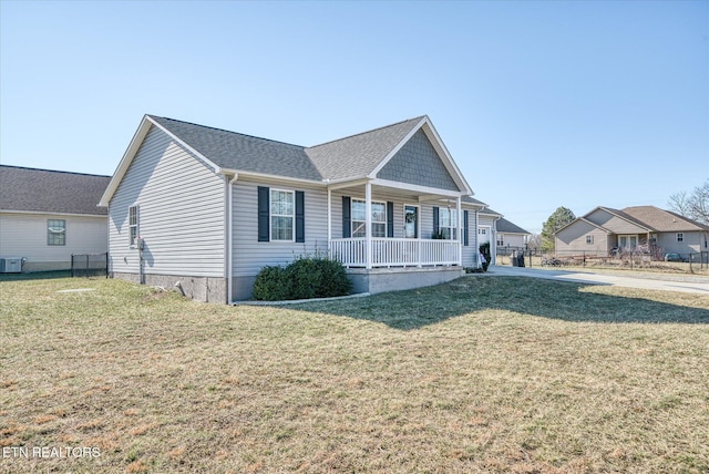 ranch-style house with central AC, covered porch, and a front lawn