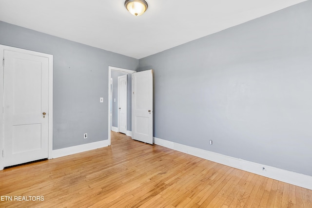 spare room with light hardwood / wood-style floors