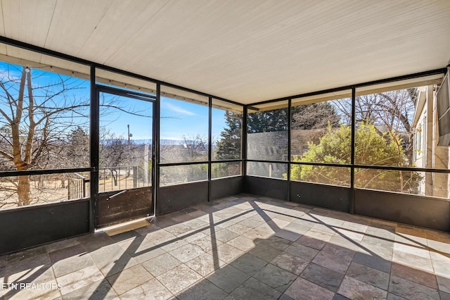 unfurnished sunroom with plenty of natural light