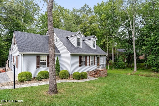 new england style home with a front yard