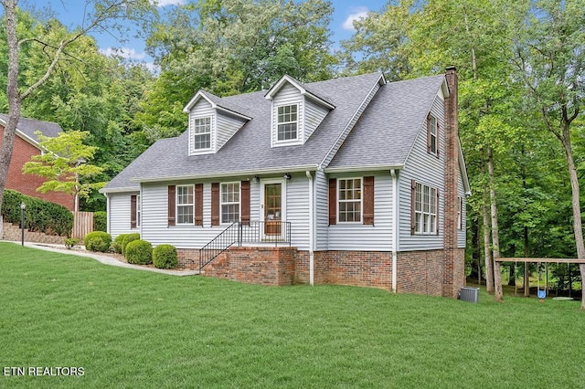 cape cod home with central AC and a front lawn