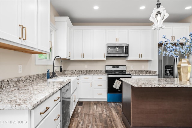 1918 Willow Grove Hwy, Monroe, TN 38573 - kitchen featuring appliances with stainless steel finishes, a sink, white cabinetry, and recessed lighting