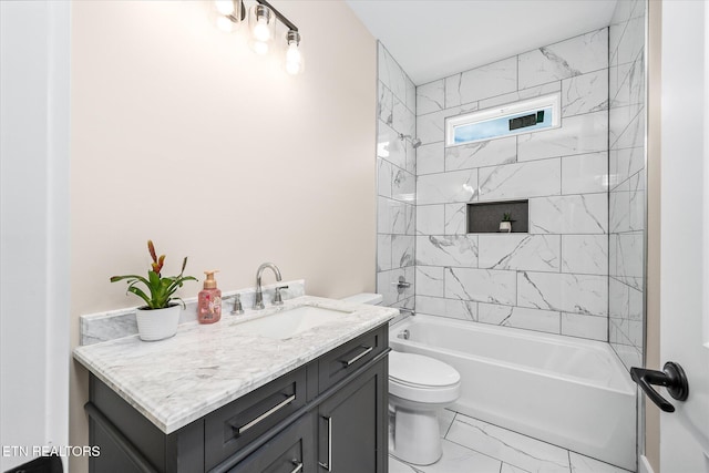1918 Willow Grove Hwy, Monroe, TN 38573 - full bathroom featuring toilet, marble look tile flooring, vanity, and shower / washtub combination
