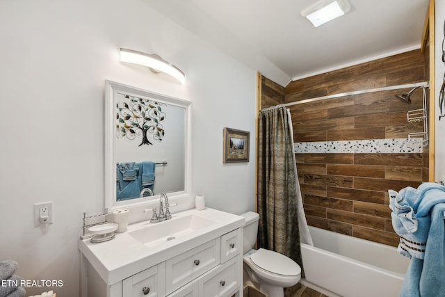 full bathroom featuring vanity, toilet, and shower / bathtub combination with curtain