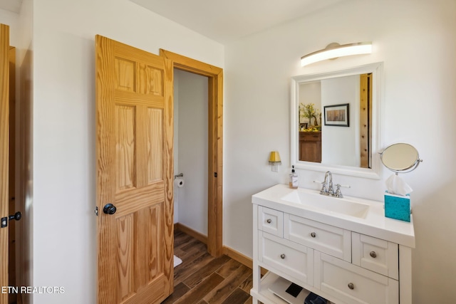 bathroom with vanity and hardwood / wood-style floors