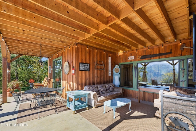 view of patio with an outdoor living space and a jacuzzi