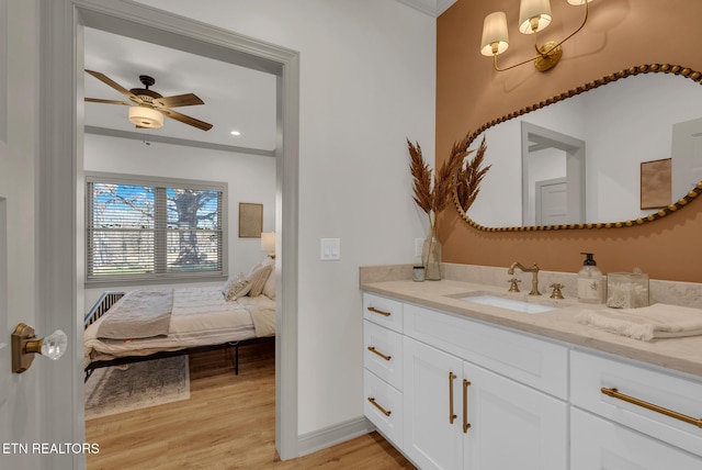 309 W Cleveland Ave, Monterey, TN 38574 - bathroom featuring vanity, hardwood / wood-style floors, and ceiling fan