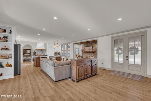 309 W Cleveland Ave, Monterey, TN 38574 - living room with french doors, ornamental molding, and light hardwood / wood-style flooring