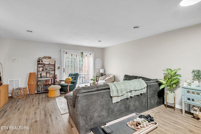 living room with light hardwood / wood-style flooring