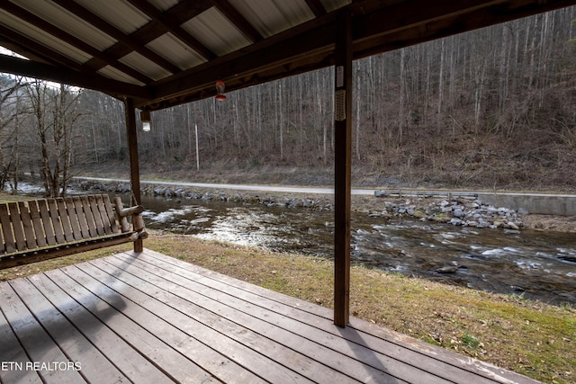 wooden terrace with a water view