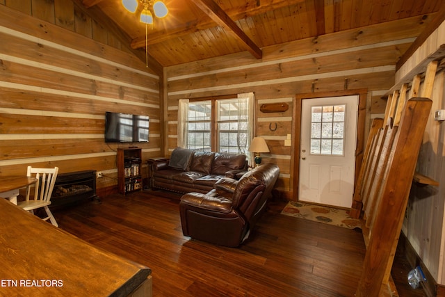 living room with wooden walls, vaulted ceiling with beams, dark hardwood / wood-style flooring, ceiling fan, and wooden ceiling