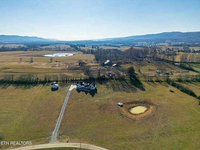 birds eye view of property featuring a mountain view and a rural view