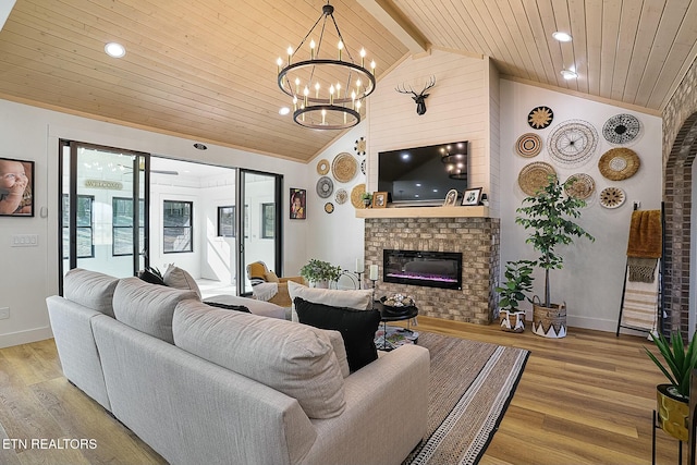 living room with a fireplace, wood ceiling, light hardwood / wood-style flooring, and lofted ceiling with beams