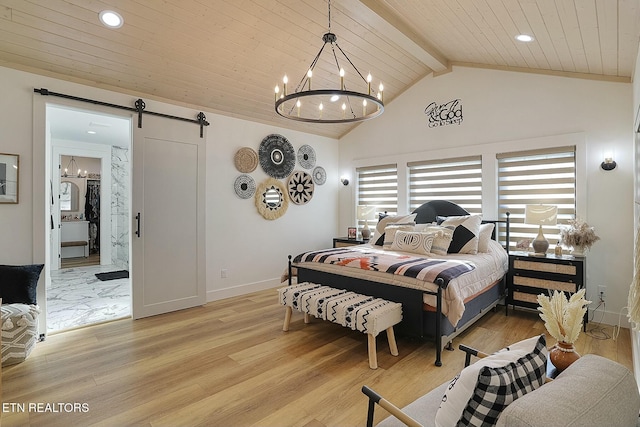 bedroom with beam ceiling, light hardwood / wood-style floors, a barn door, and a chandelier