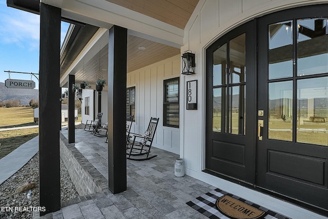 property entrance with covered porch