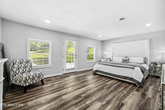 bedroom featuring access to exterior and dark hardwood / wood-style flooring